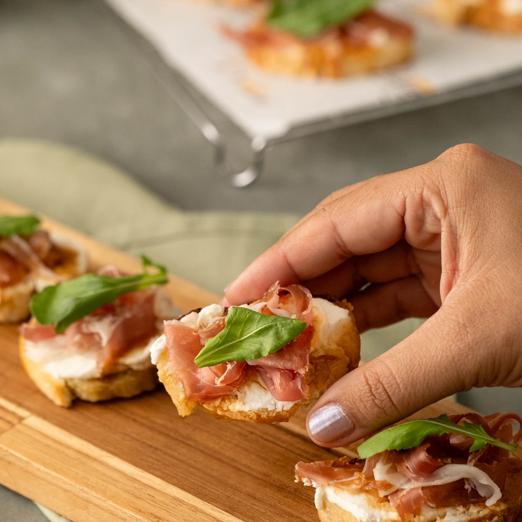 Canapé de creme siciliano, parma, mel de figo e rúcula